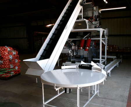 Ag-Pak clipper with elevator infeed table